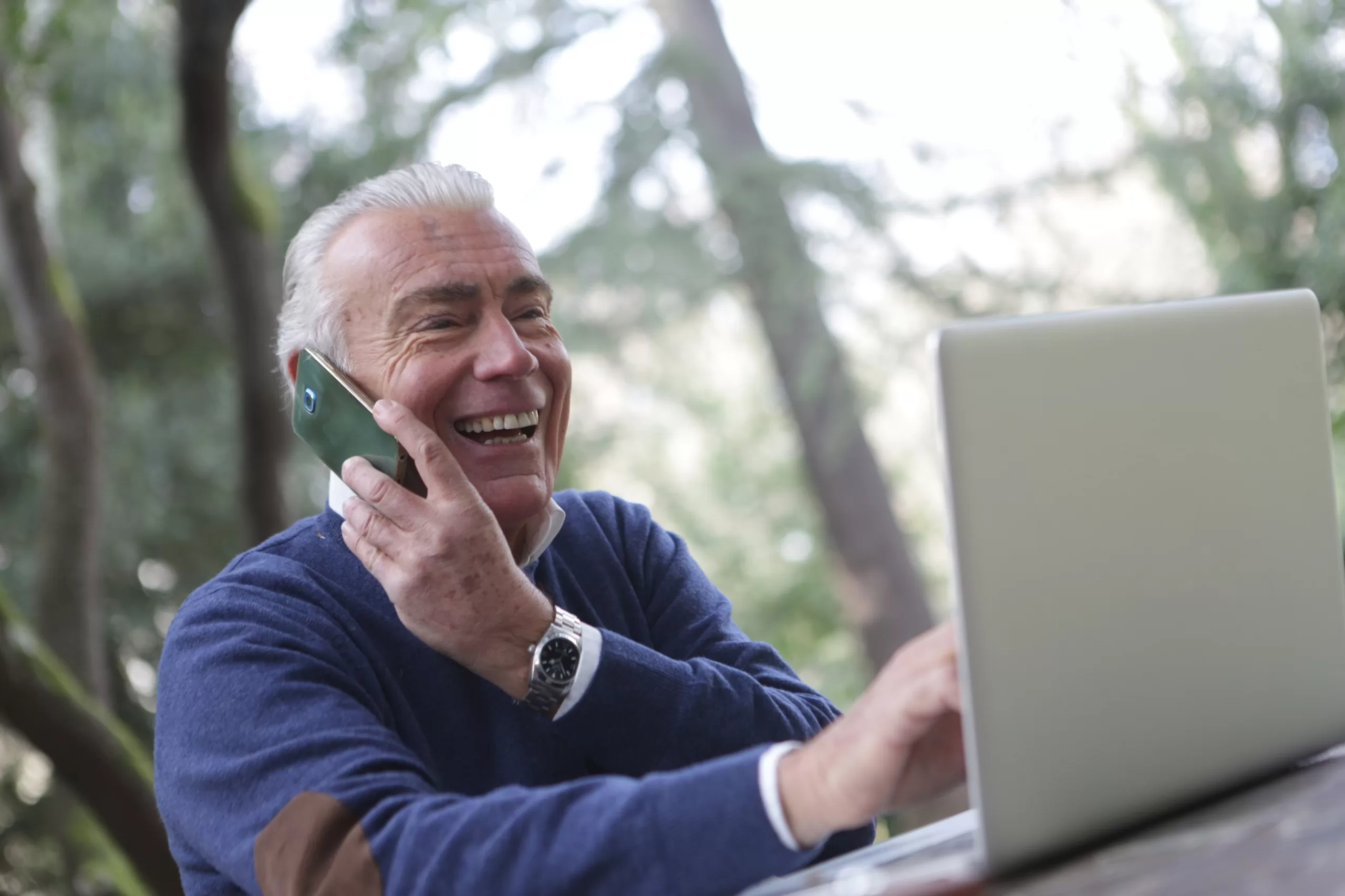 mature man on phone and laptop